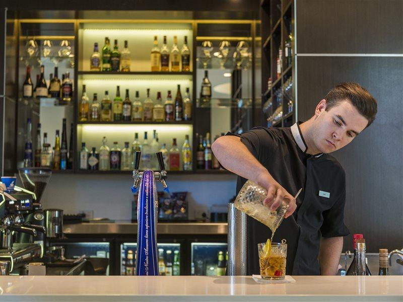 The Point Brisbane Hotel Экстерьер фото A bartender at work