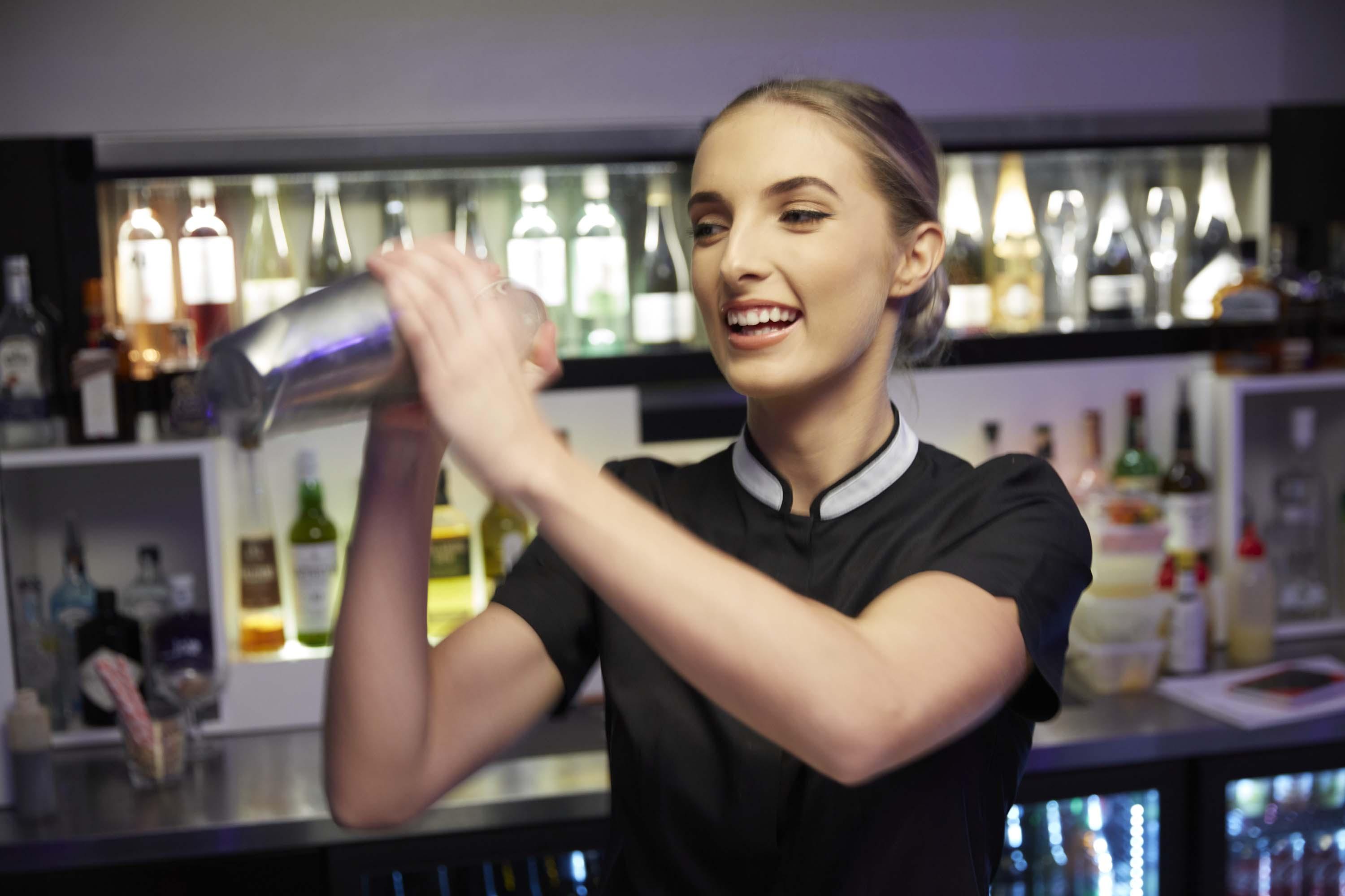 The Point Brisbane Hotel Экстерьер фото A bartender shaking a cocktail