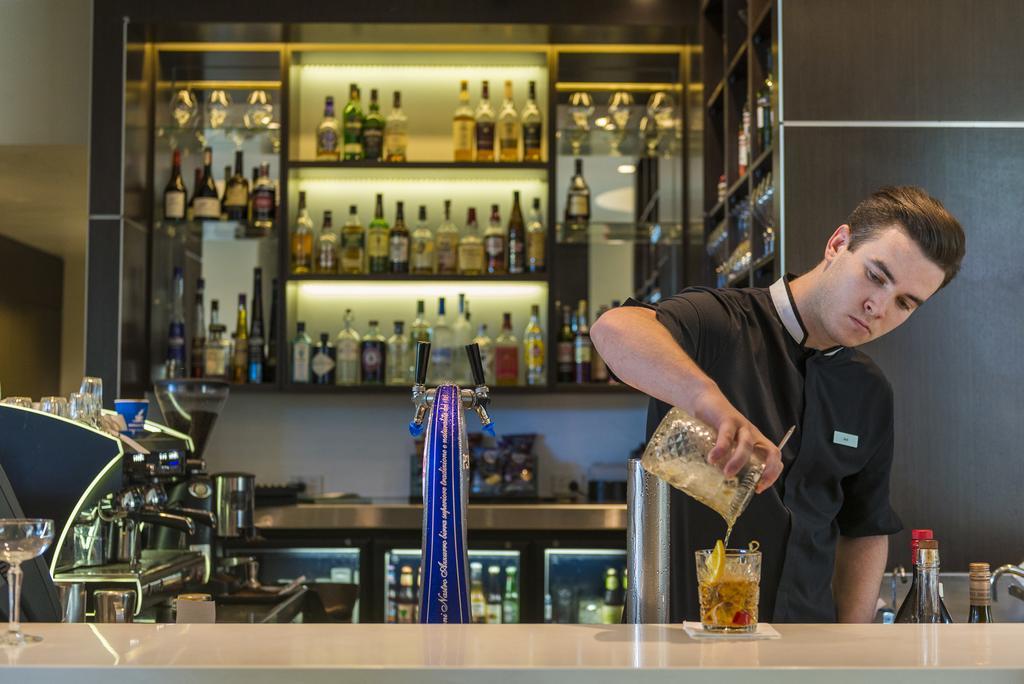 The Point Brisbane Hotel Экстерьер фото A bartender at work